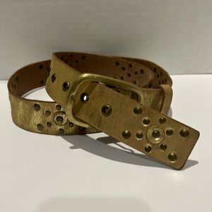 Calvin Klein ladies leather belt size large.  Metallic gold with studded detail